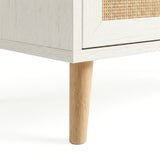 [White] Wovena rattan tallboy chest base view: angled pine leg meeting white carcass and woven cane front