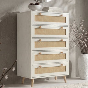 [White] Wovena rattan tallboy chest with five cane drawers angled view, ceramic bowl and round mirror styled on top