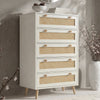[White] Wovena rattan tallboy chest with five cane drawers angled view, ceramic bowl and round mirror styled on top