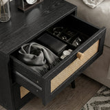 [Black] Open top drawer of black Wovena rattan bedside revealing storage with personal items and accessories