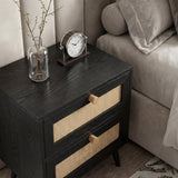 [Black] Wovena rattan bedside side angle next to grey sofa showing cane weave drawers and timber knobs