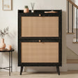 [Black] Wovena Rattan Black 2 Door Shoe Storage Cabinet front-facing in neutral hallway with black balustrade staircase and round black side table alongside