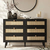[Black] Wovena rattan chest front view in styled bedroom with round mirror, dried branches in vase and pillar candles on top