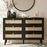 [Black] Wovena rattan chest front view in styled bedroom with round mirror, dried branches in vase and pillar candles on top