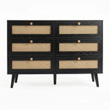 [Black] Wovena rattan chest cut-out front view on white background with six closed cane drawers and four dark legs