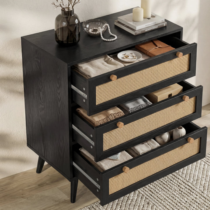 [Black] Wovena rattan chest with all three cane-front drawers open showing 65cm wide interiors