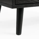[Black] Wovena rattan chest tapered leg detail at base corner of the black painted frame