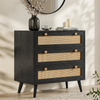 [Black] Wovena rattan chest angled in hallway with round mirror above and dried stems in vase