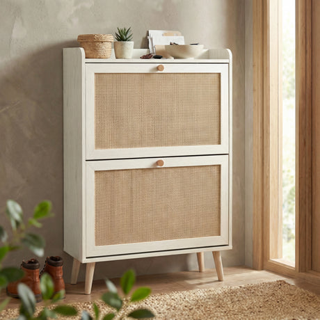 [White] Angled lifestyle view of the Wovena rattan shoe cabinet styled in a hallway setting