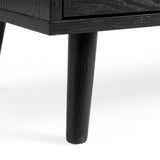 [Black] Wovena rattan tallboy leg detail showing architectural splayed base