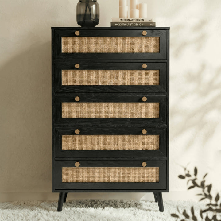 [Black] Wovena rattan tallboy chest of drawers in black with splayed legs on rug