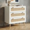 [White] Wovena White Rattan 3 Chest of Drawers, Pine legs angled look against a modern textured grey wall.