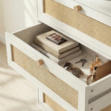 [White] Wovena rattan chest from above-angle showing drawers extended on smooth runners with folded contents