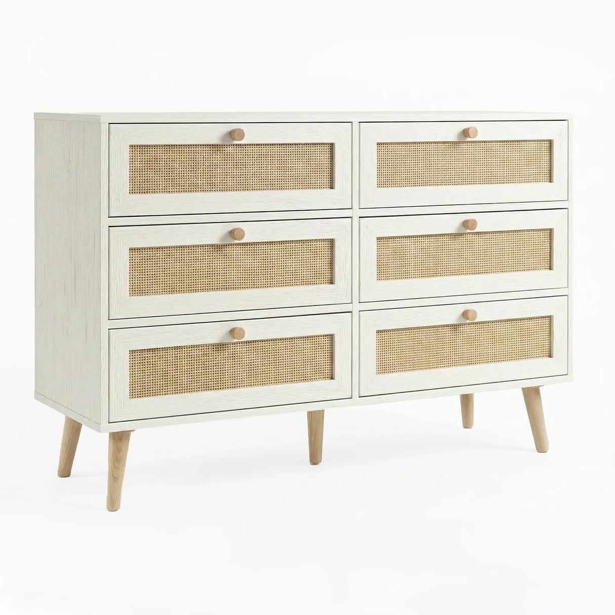 [White] Wovena rattan chest three-quarter angle in a warm-toned bedroom with splayed pine legs visible