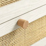 [White] Wovena close-up of round hardwood knob set against rattan cane mesh weave and melamine frame edge
