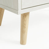 [White] Wovena close-up of splayed pine leg and lower body corner showing natural wood against melamine finish