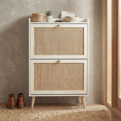 [White] Front view of the Wovena rattan 2 door shoe storage cabinet with both compartments closed and splayed pine legs