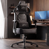 [Black] gaming chair with white XTRAKIR logos on the headrest and lumbar support, positioned in a modern home office setup with a desk, dual monitors, and wood flooring.