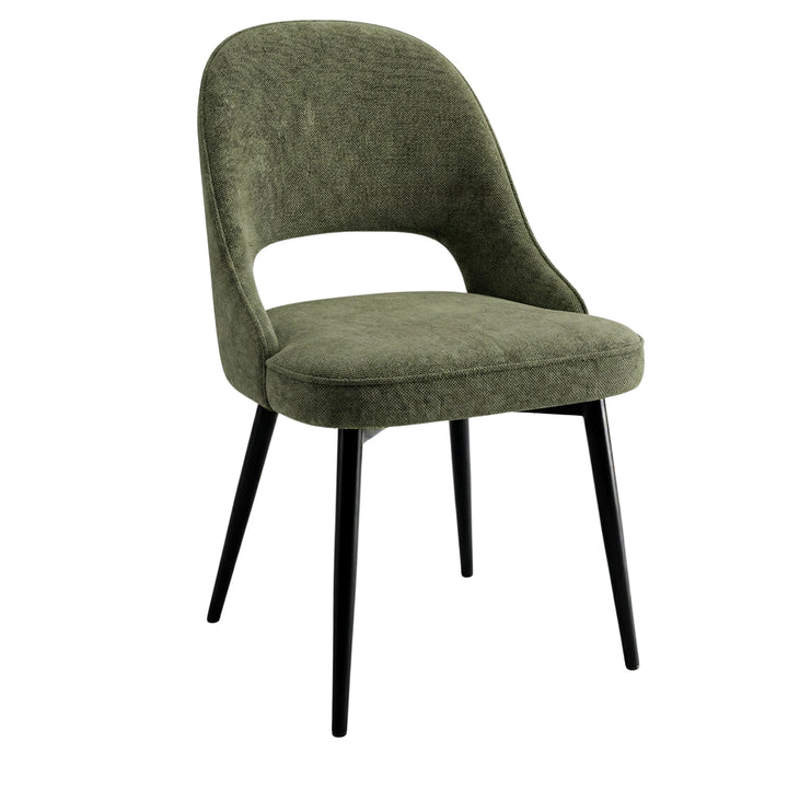 [6 Seater | Green] Profile shot of sage green Xylon chair â€” curved-back silhouette and splayed black leg