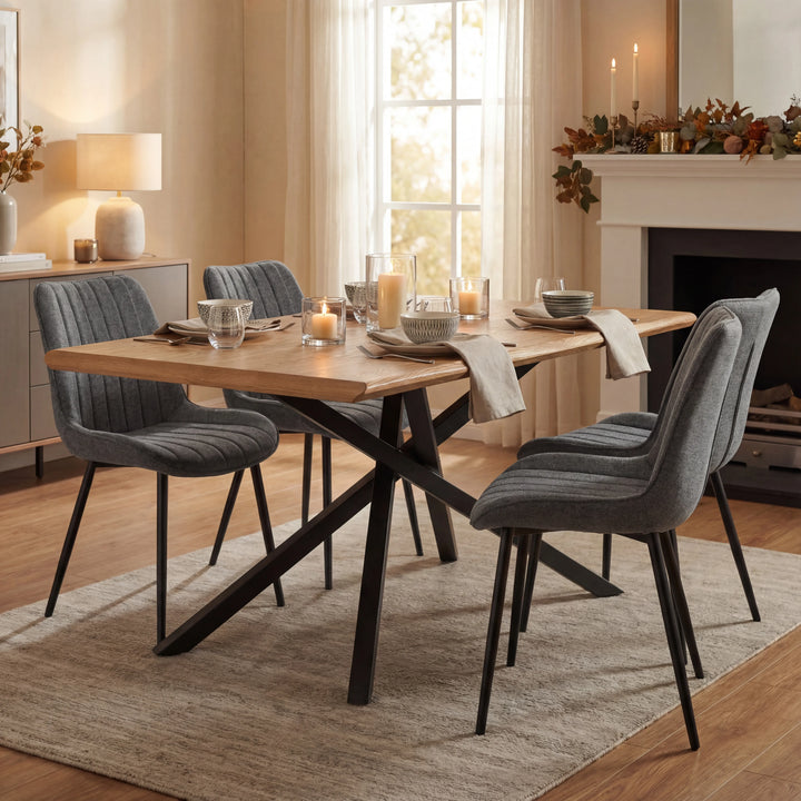 [4 Seater | Grey] Holiday-dressed Xylon dining table with 4 grey chairs, candles and place settings on oak surface